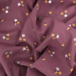 Velours milleraie fleuri sur fond aubergine